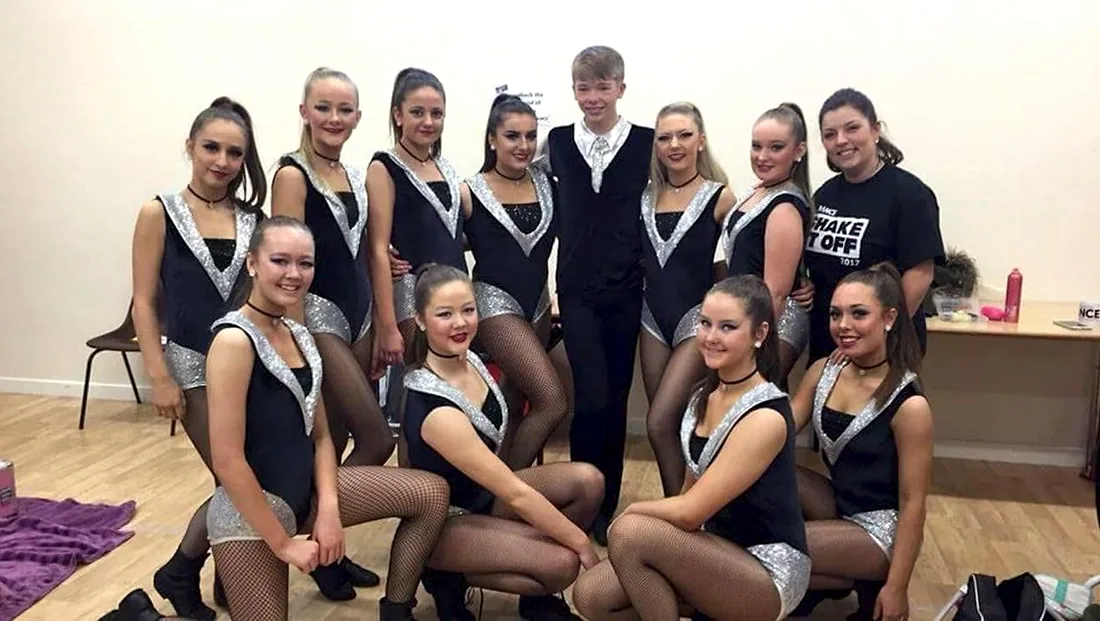 Libby with a senior JL Dance team in costume