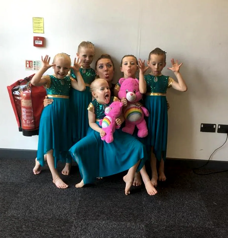 Libby with younger JL dancers in matching costumes